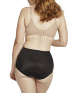 a woman wearing black tummy control underwear shapewear