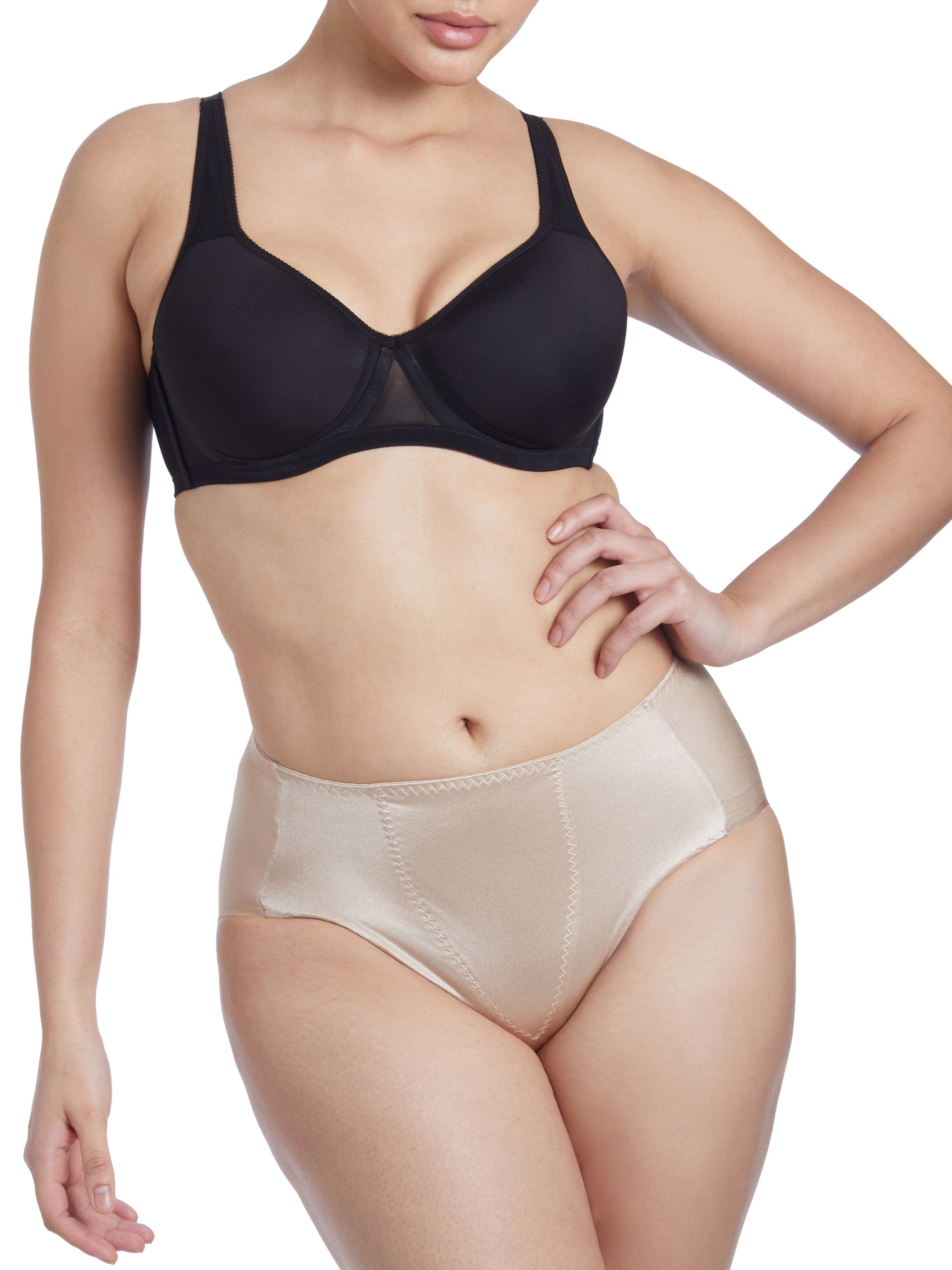 a woman wearing a beige shaping brief