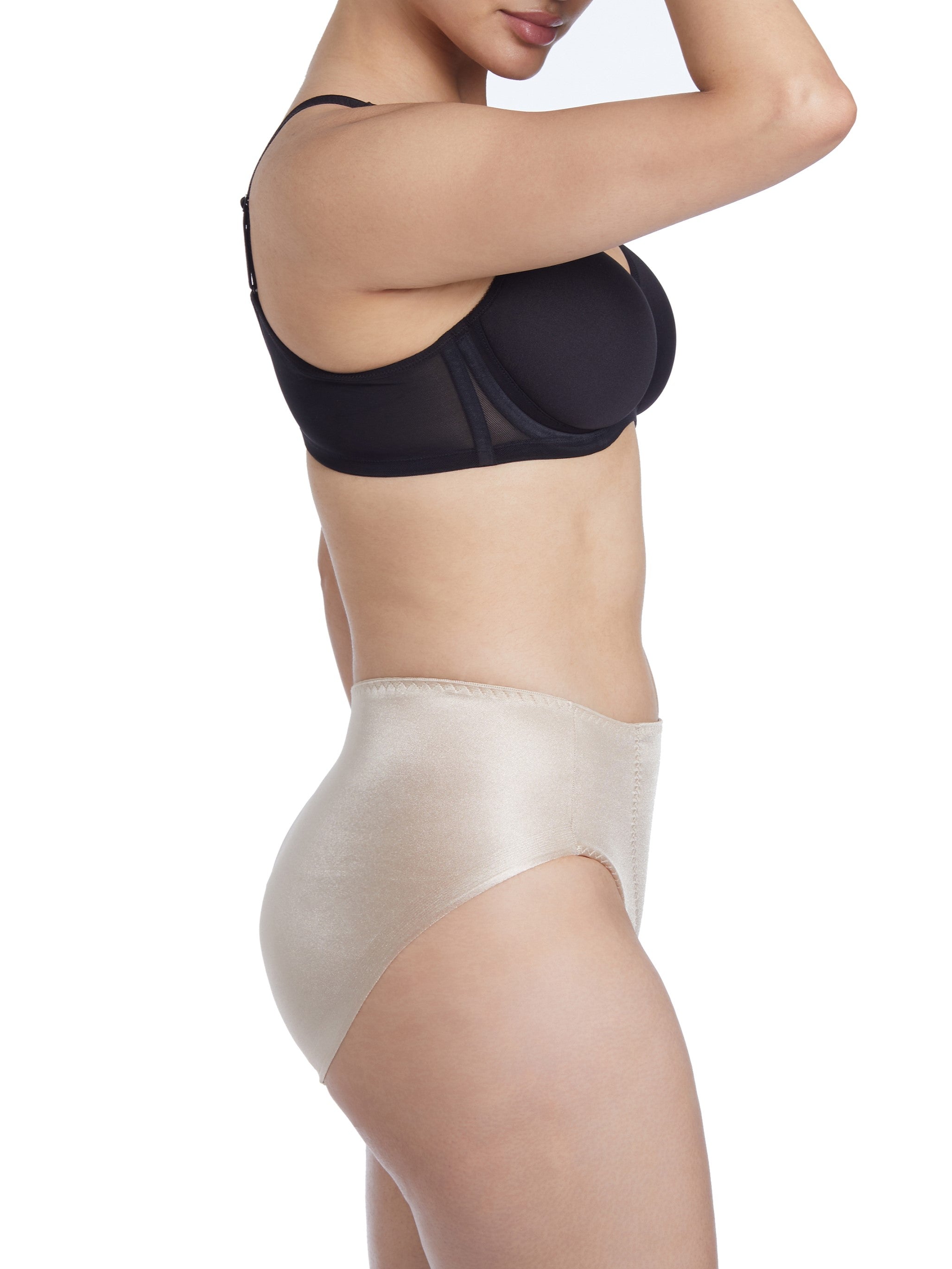 a woman wearing a beige shaping brief