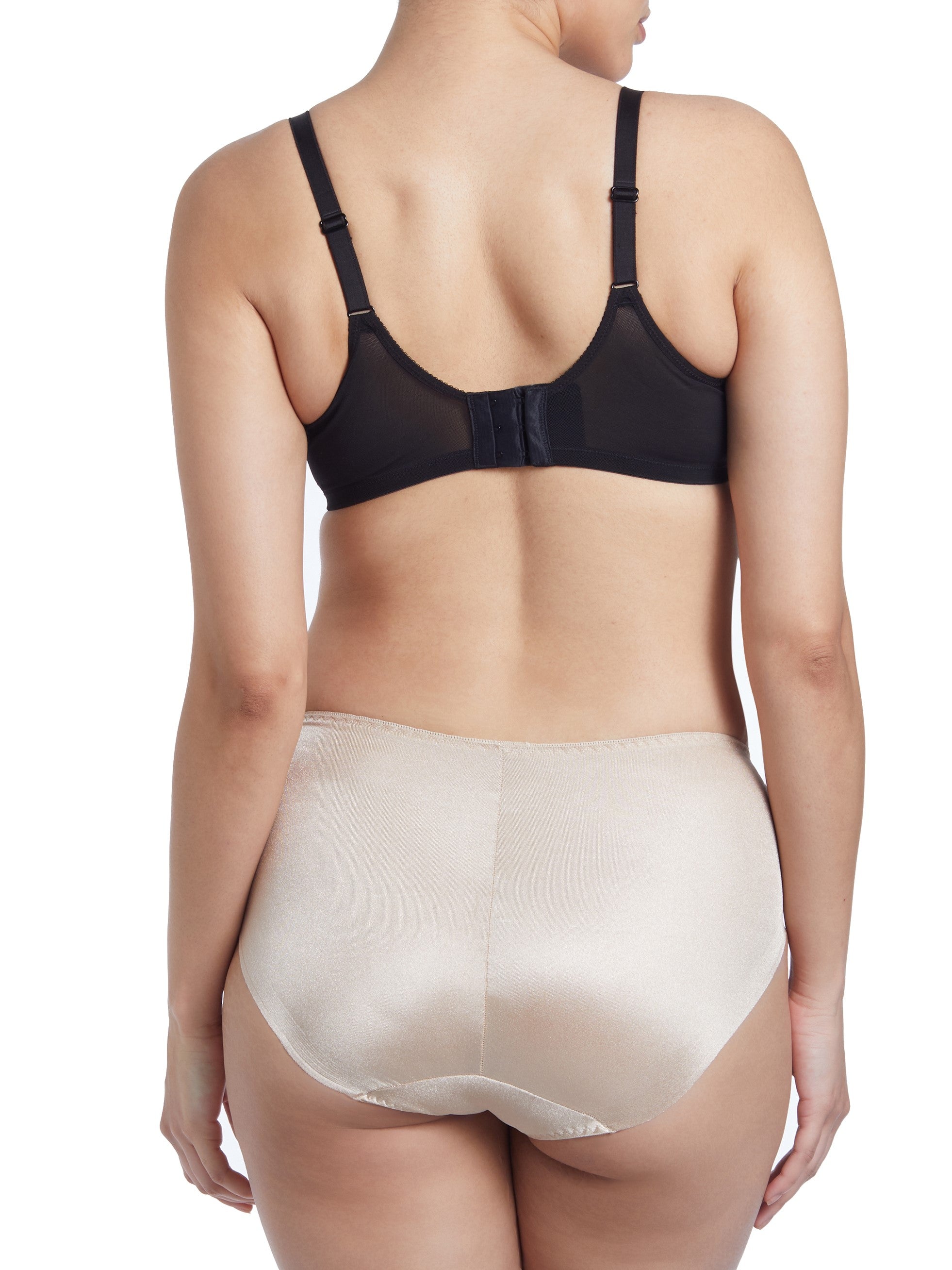 a woman wearing a beige shaping brief