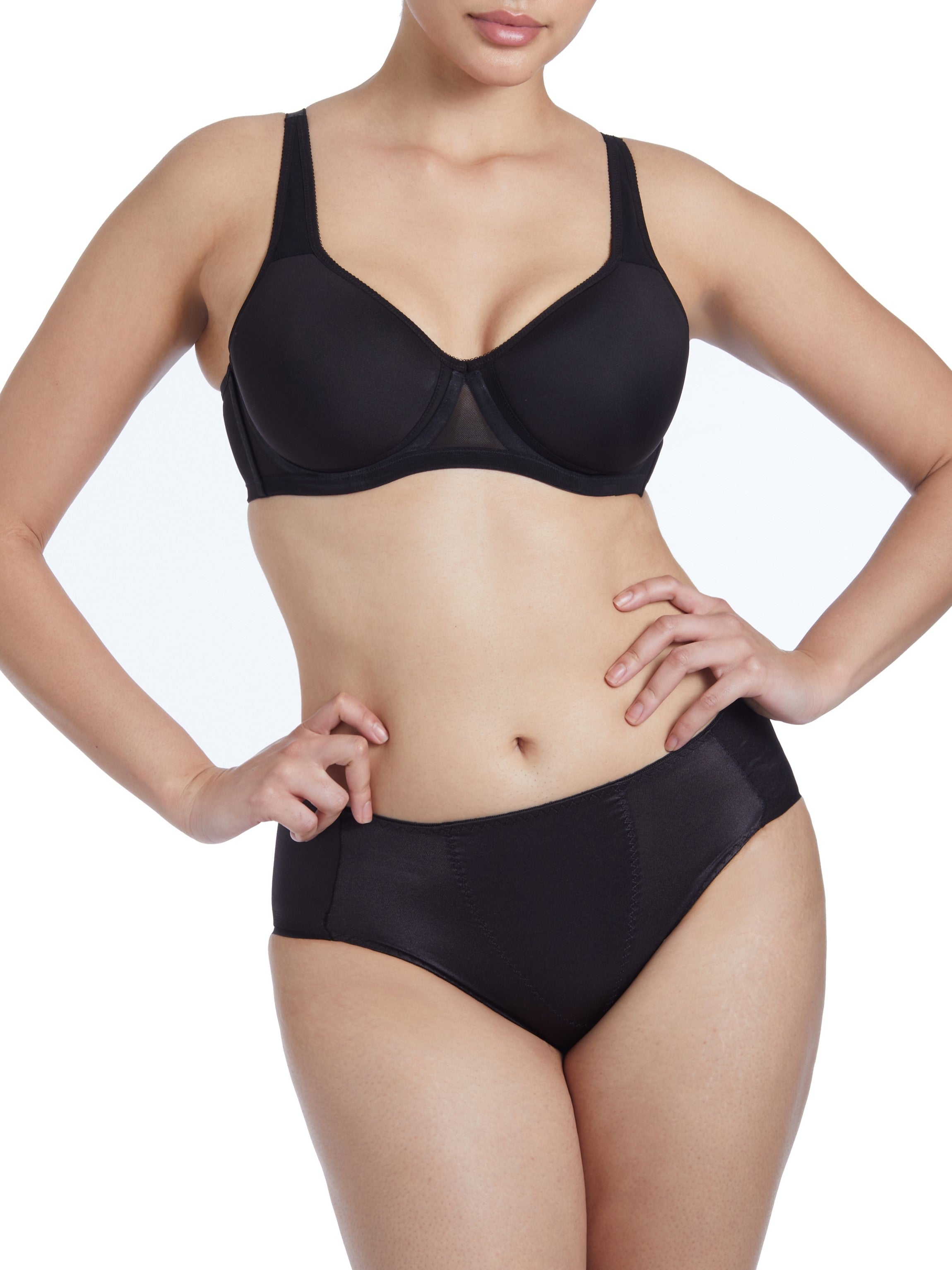 a woman wearing a black shaping brief