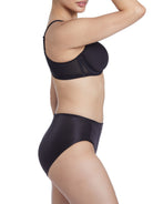 a woman wearing a black shaping brief