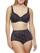 a woman wearing black tummy control underwear