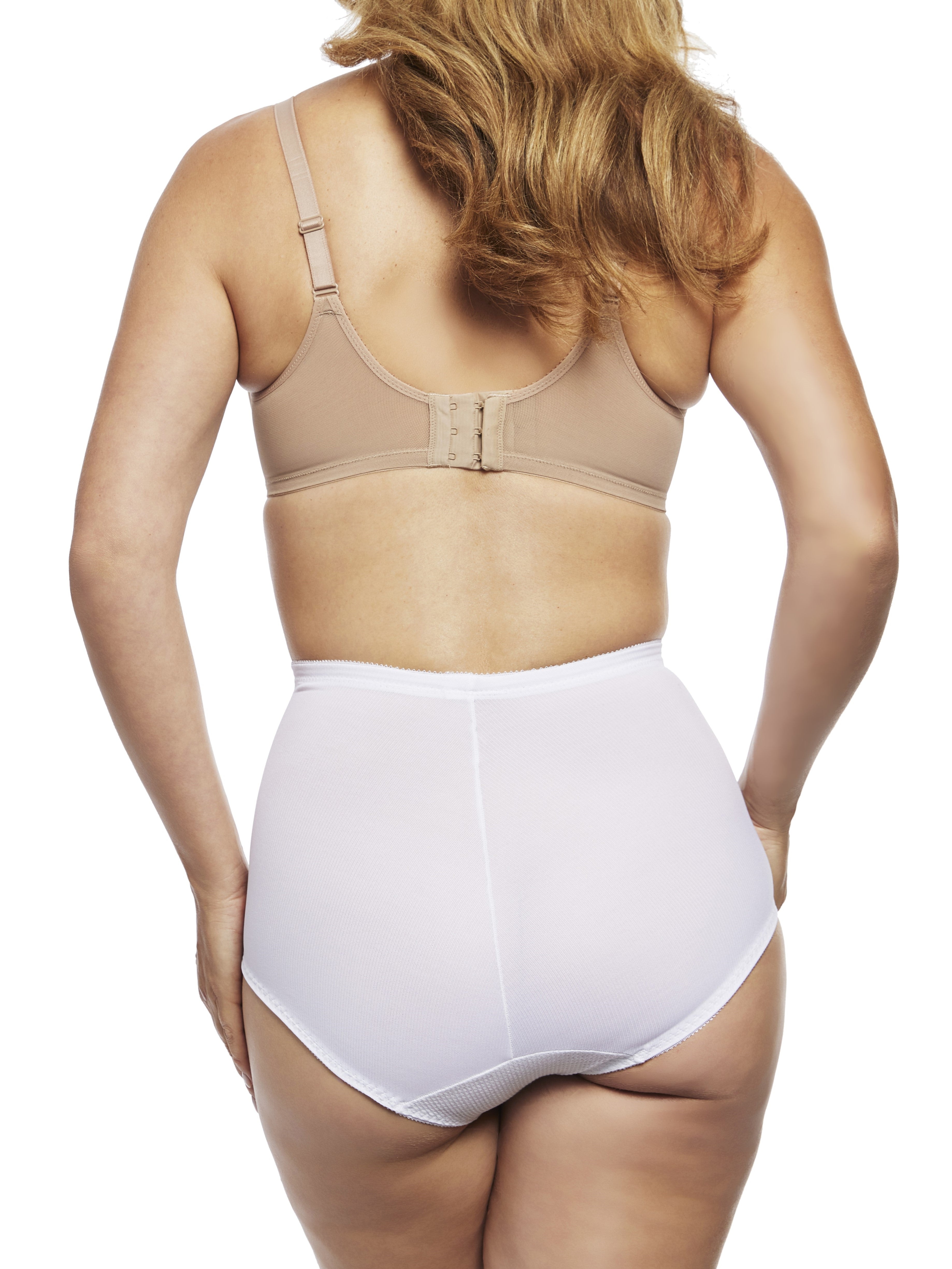 a woman wearing white tummy control underwear