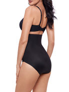 a woman wearing a black high waisted tummy control brief shapewear