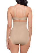 a woman wearing a nude high waisted tummy control brief shapewear