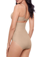 a woman wearing a nude high waisted tummy control brief shapewear