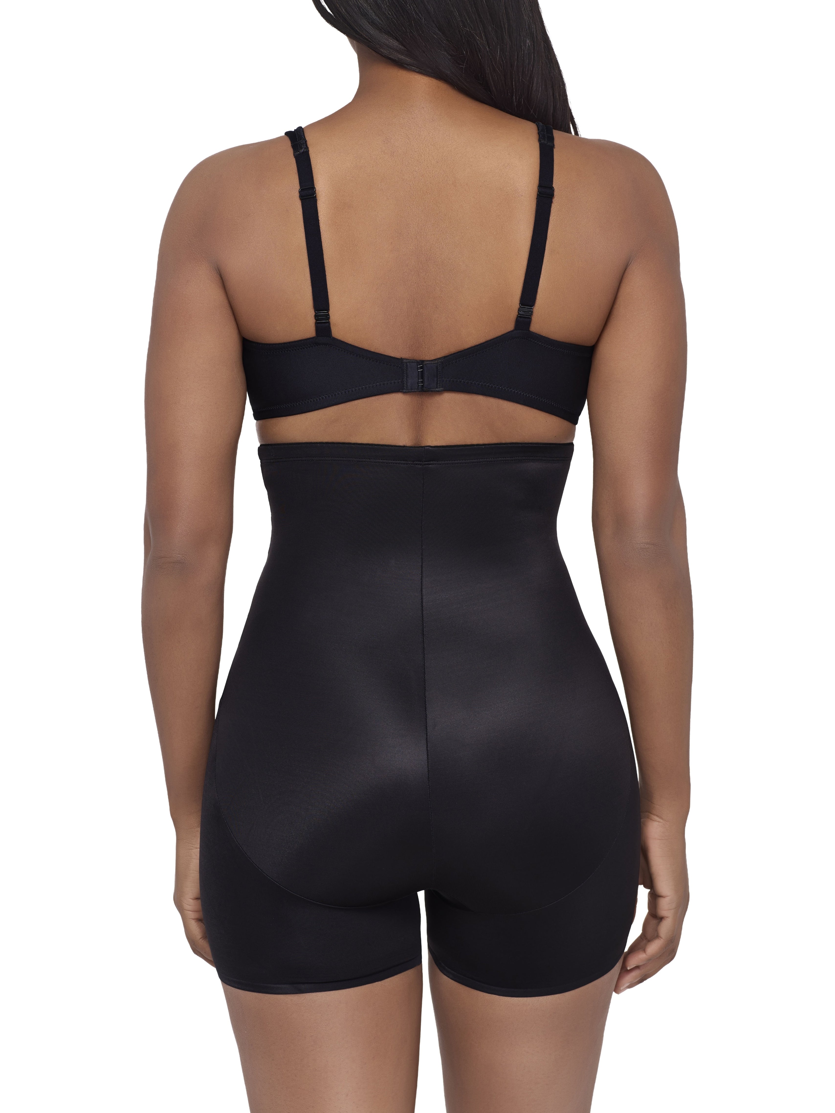 a woman wearing a black high waisted tummy tucker shaping short miraclesuit shapewear body shaper boyshort