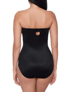 a woman wearing a black strapless shapewear bodysuit total body shaper