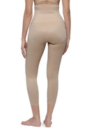 Rear view of a model wearing high-waisted beige shapewear leggings against a plain white background.