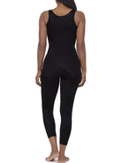 A woman modeling a full-body black shaper bodysuit or against a plain white background.