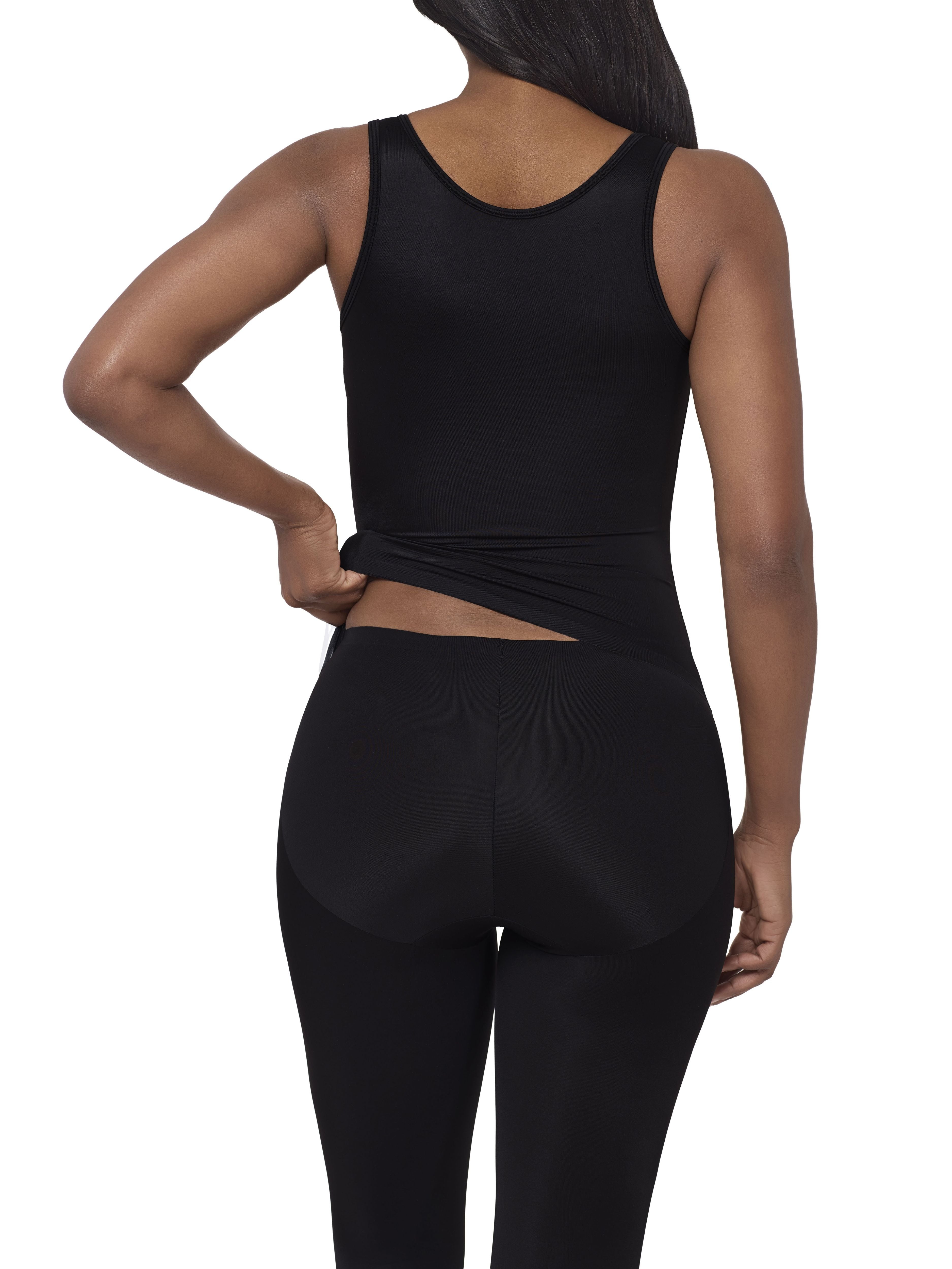 A woman modeling a full-body black shaper bodysuit or against a plain white background.