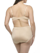 Woman wearing a beige bra and shapewear brief set on a white background