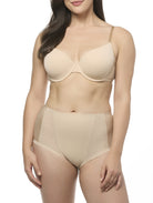 Woman wearing a beige bra and shapewear brief set on a white background