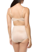 a woman wearing a beige tummy control panty