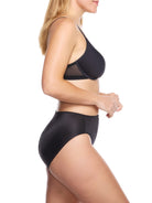 a woman wearing black tummy control underwear