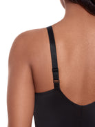 a close up of straps of a woman wearing a black shaping camisole