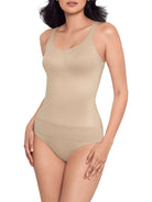 a woman wearing a nude tummy control shaping cami shapewear