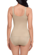 a woman wearing a nude tummy control shaping cami shapewear