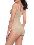 a woman wearing a nude tummy control shaping cami shapewear