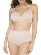 a woman wearing a beige shaping brief