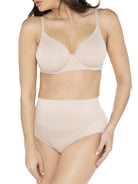 a woman wearing a beige shaping brief