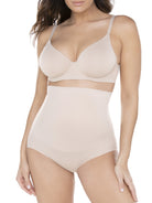 a woman wearing a beige high-waist shaping brief