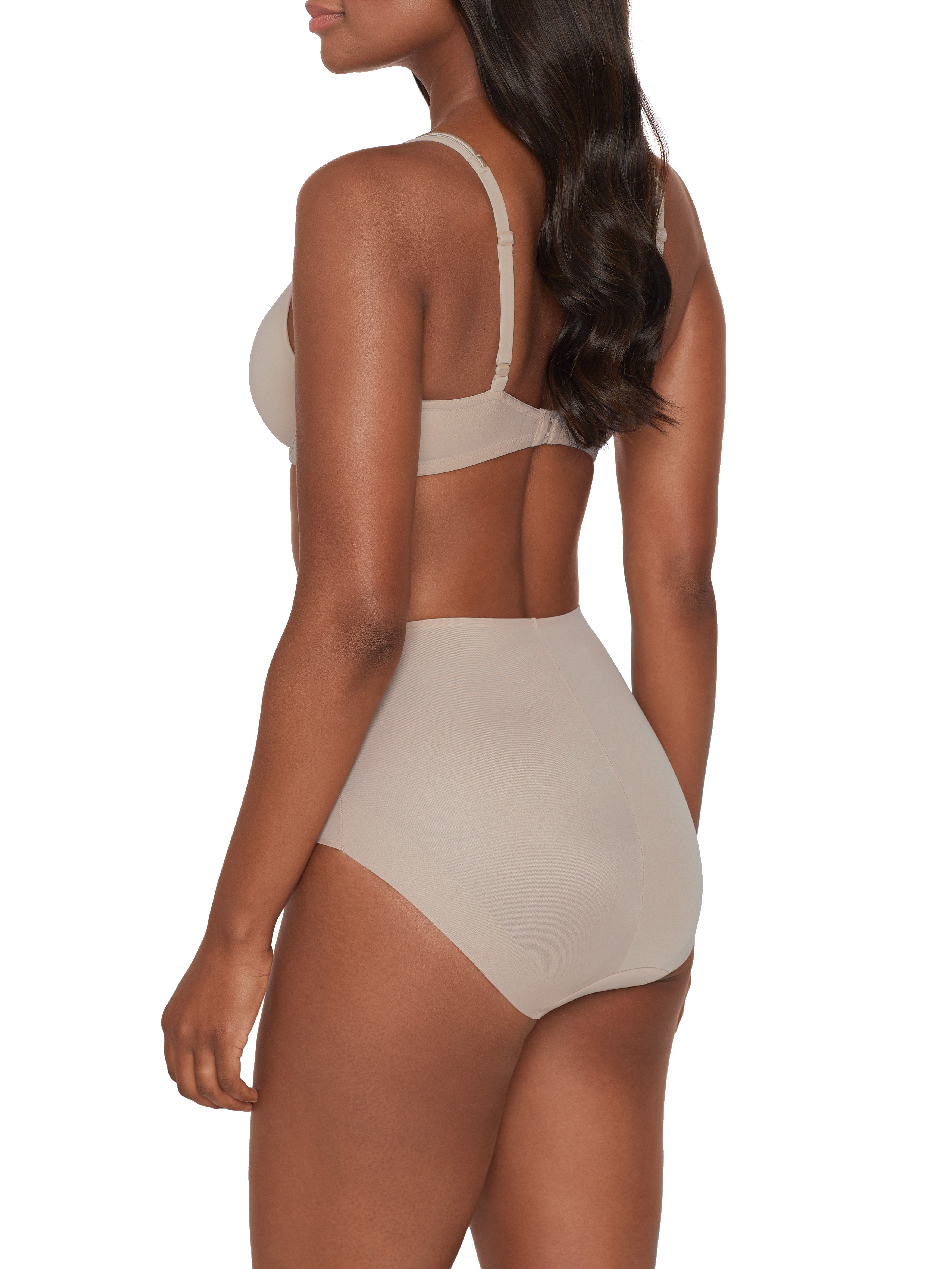 a woman wearing a beige shaping brief all-groups