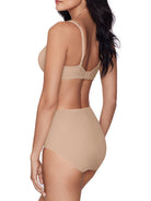 a woman wearing beige tummy control underwear shapewear all-groups