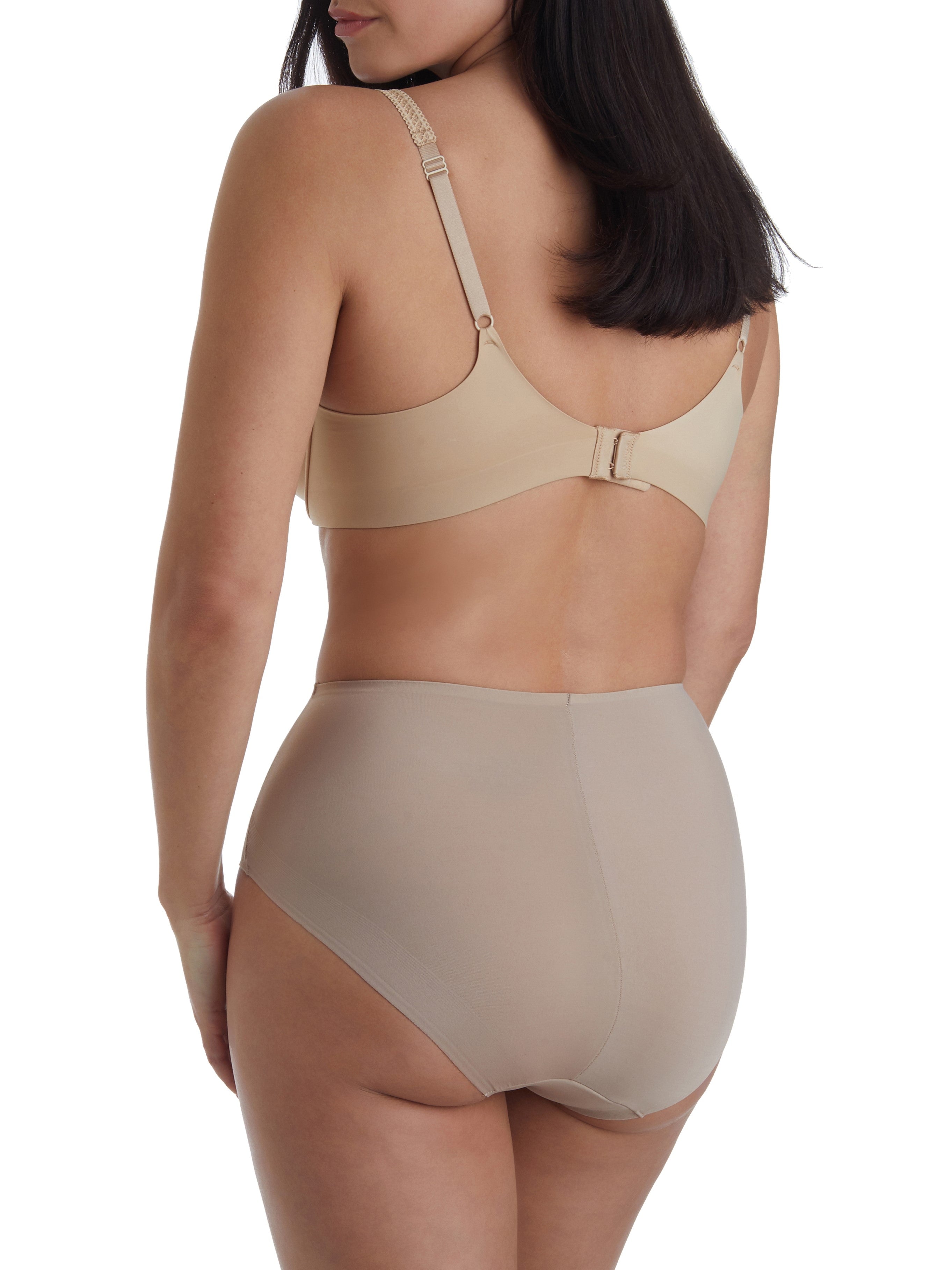 a woman wearing tan tummy control underwear