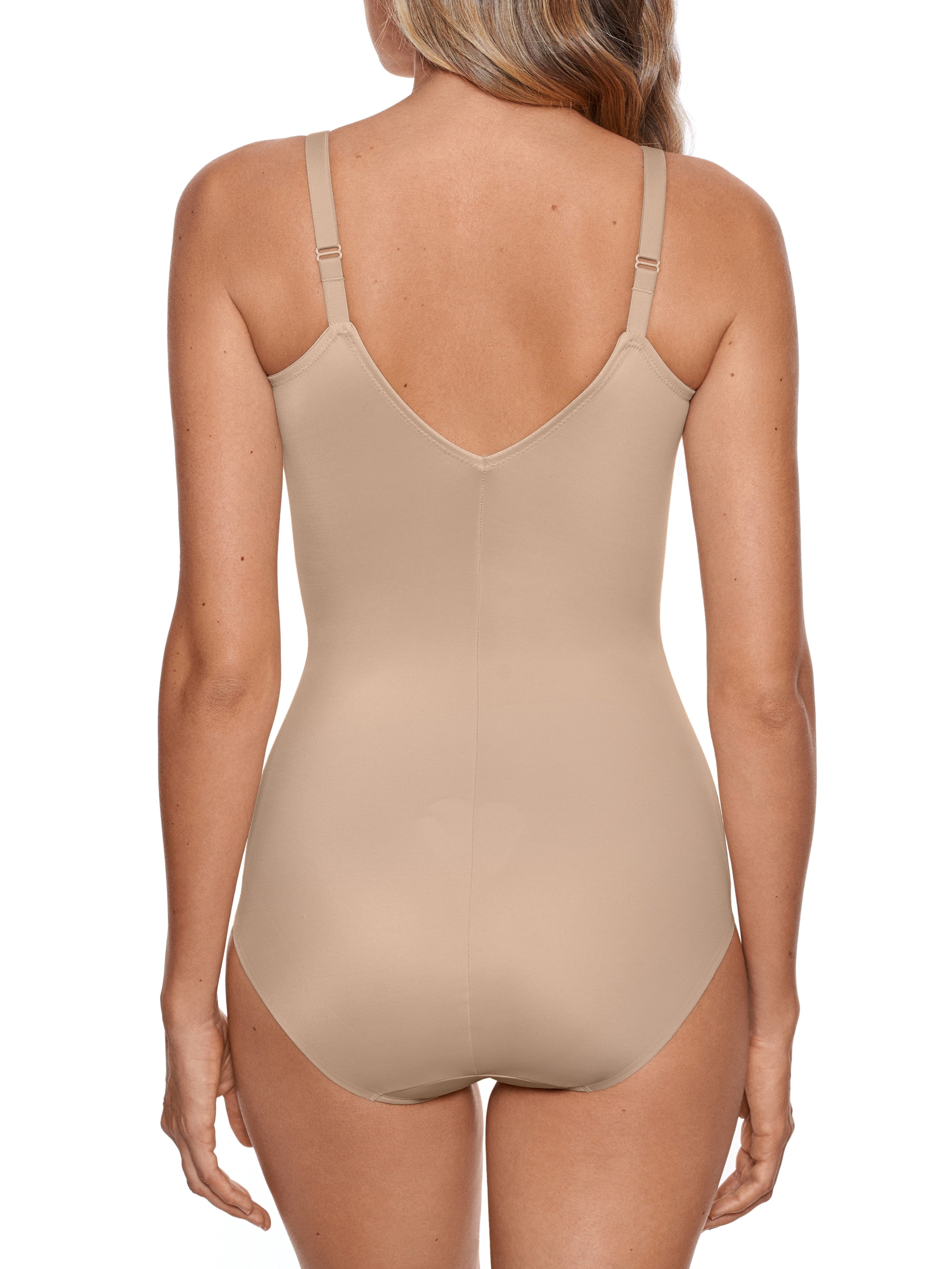 a woman wearing a nude tummy control body shaper