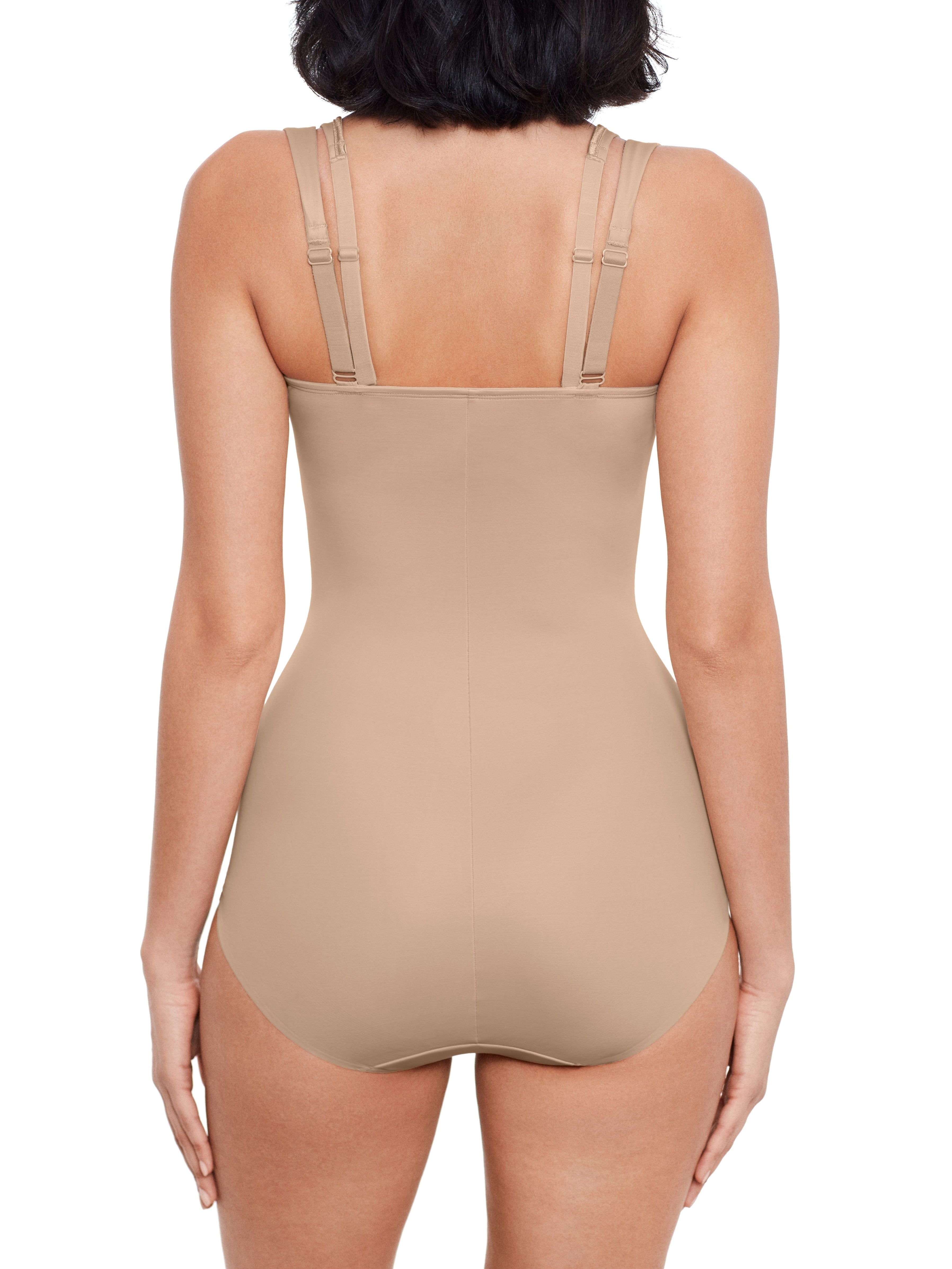 a woman wearing a nude open bust tummy control body shaper