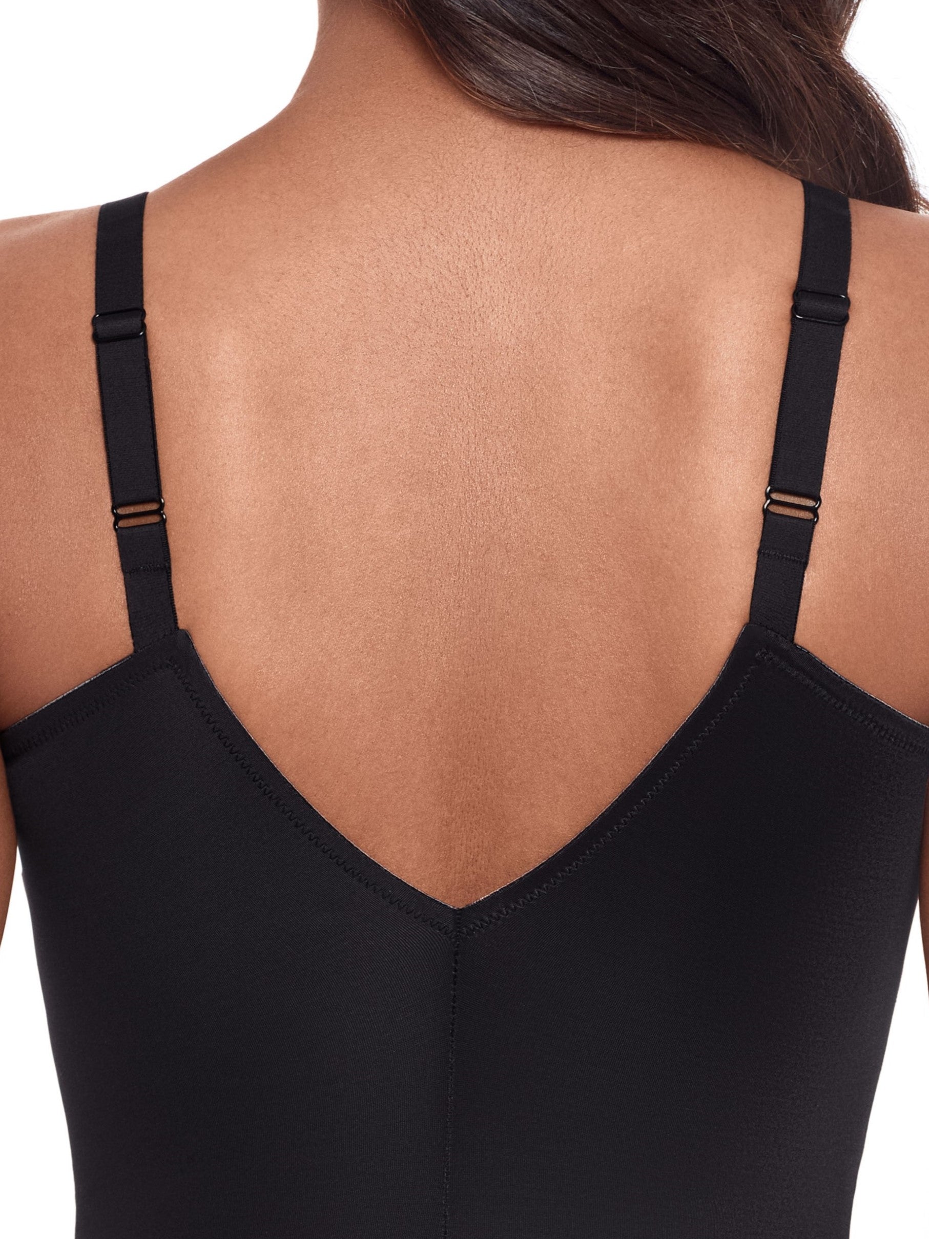 a close-up detail of a woman wearing a black tummy control shaping bodysuit