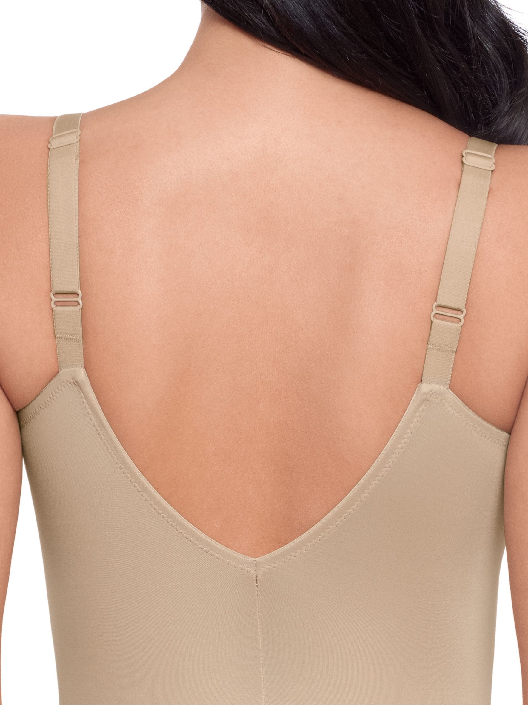 a close-up detail of a woman wearing a nude tummy control body shapera woman wearing a beige shaping bodysuit romper