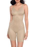 a woman wearing a beige shaping bodysuit romper