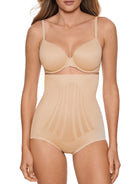 a woman wearing a beige shaping brief