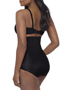a woman wearing a black high waisted tummy control brief miraclesuit shapewear body shaper