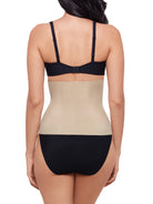 a woman wearing a nude waist cincher waist trainer shapewear