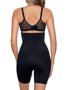 a woman wearing a black high waisted tummy control shapewear short