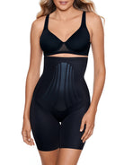 a woman wearing a black high waisted tummy control shapewear short