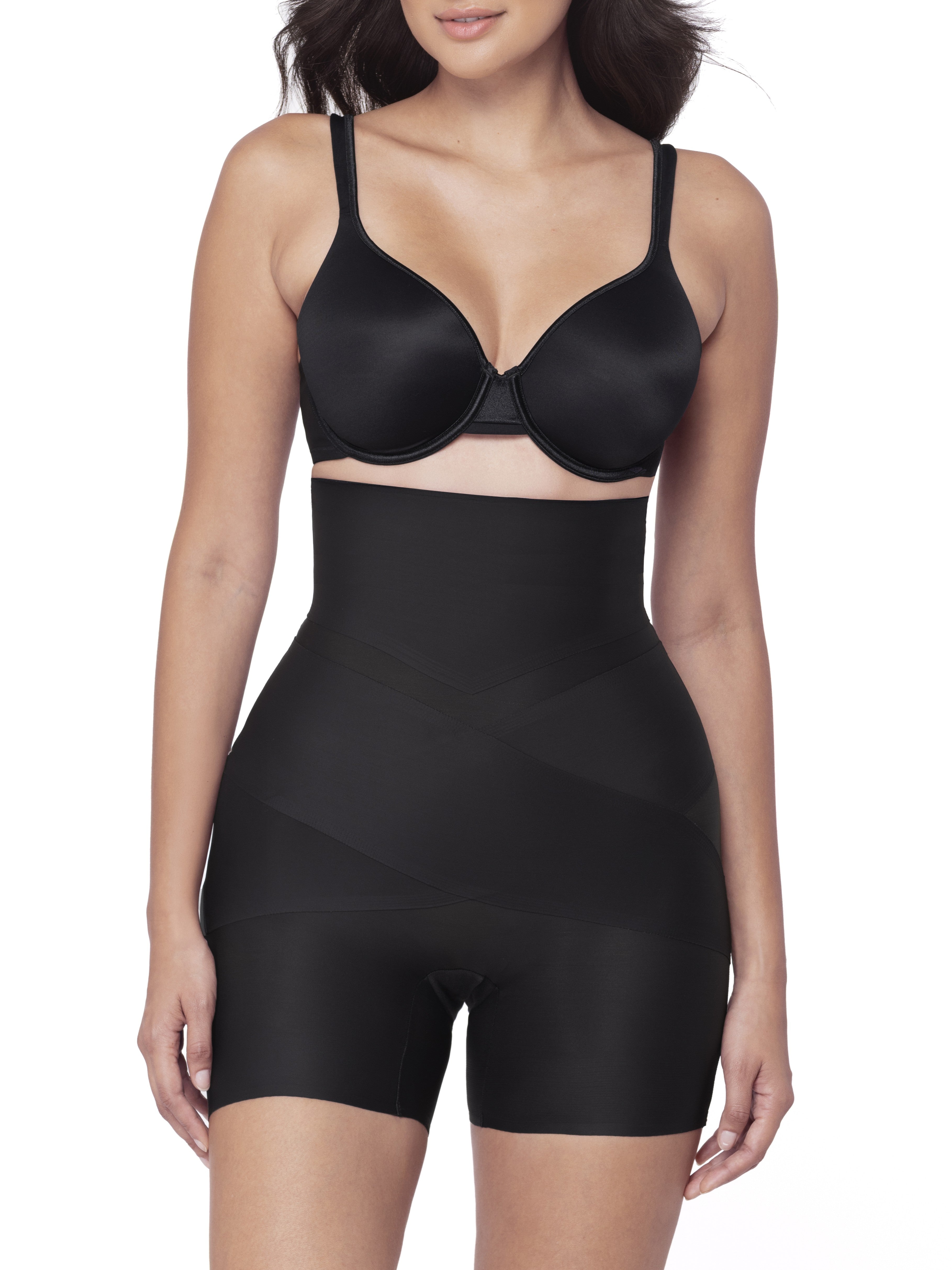 Black shapewear shorts worn by a model on a white background