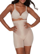 a woman wearing nude high waisted tummy control shapewear shorts