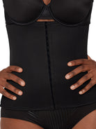 a close-up of a woman wearing a black waist trainer waist cincher shapewear