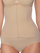 a close-up of a woman wearing a nude waist trainer waist cincher shapewear