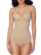 a woman wearing a beige waist cincher