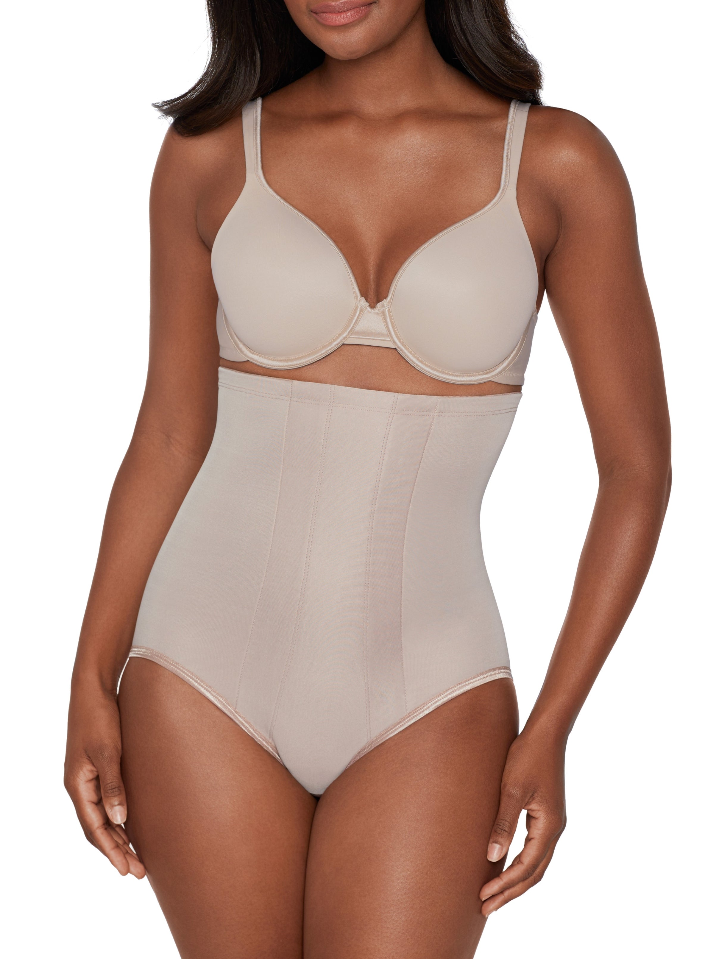 a woman wearing a beige shaping brief