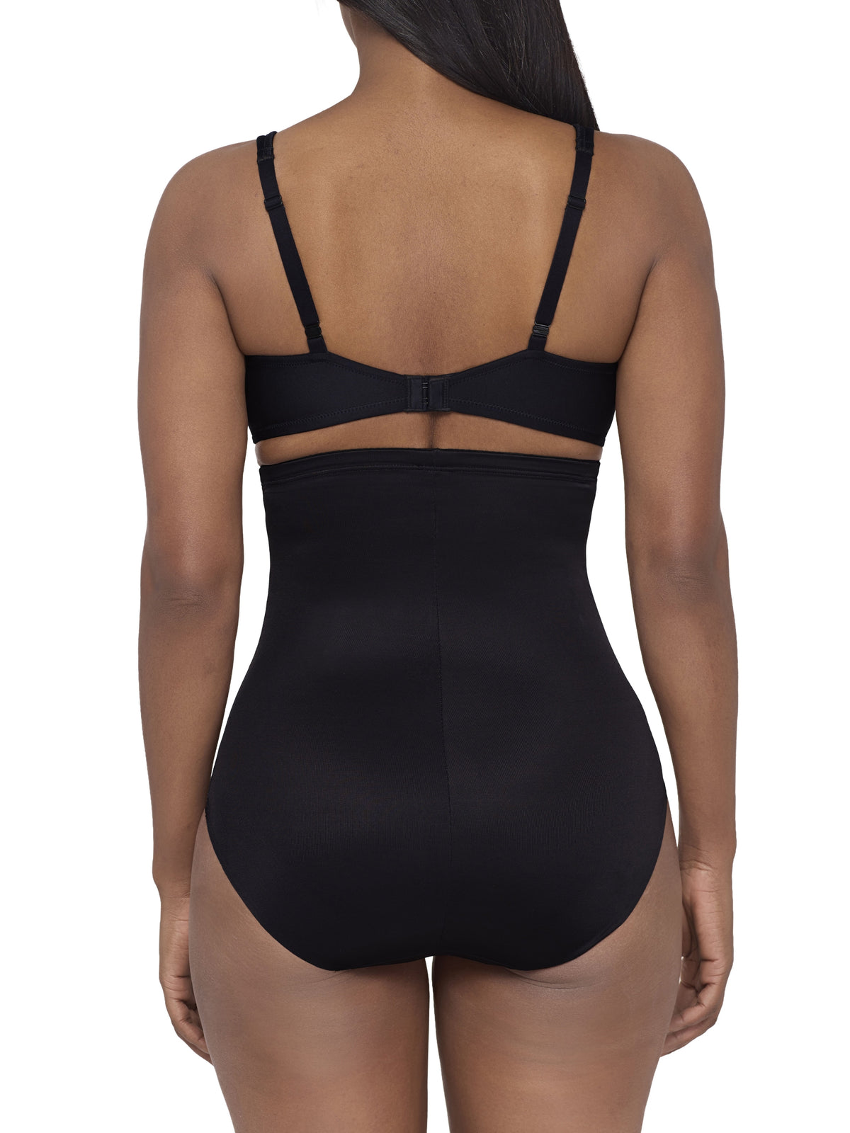 a woman wearing a black high waisted tummy control brief miraclesuit shapewear body shaper