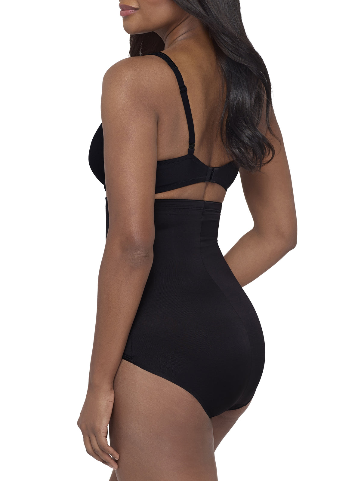 a woman wearing a black high waisted tummy control brief miraclesuit shapewear body shaper