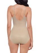 a woman wearing a nude sheer tummy control body shaper