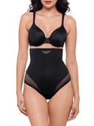 a woman wearing a black sheer high waisted tummy control top thong panty shapewear